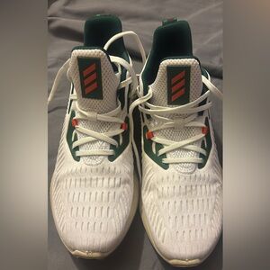Adidas White and Green Athletic Shoes with Orange Details